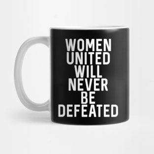 WOMEN UNITED WILL NEVER BE DEFEATED feminist text slogan Mug